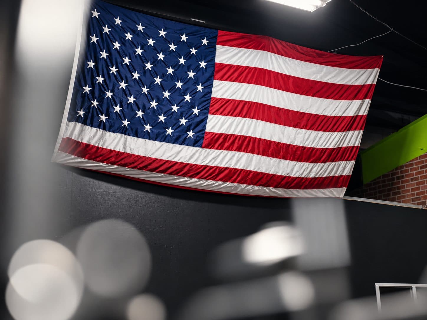 American flag hanging above the training floor at TNU Fitness