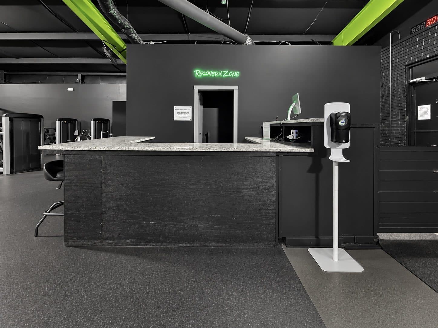 Front desk and Recovery Zone entrance at TNU Fitness