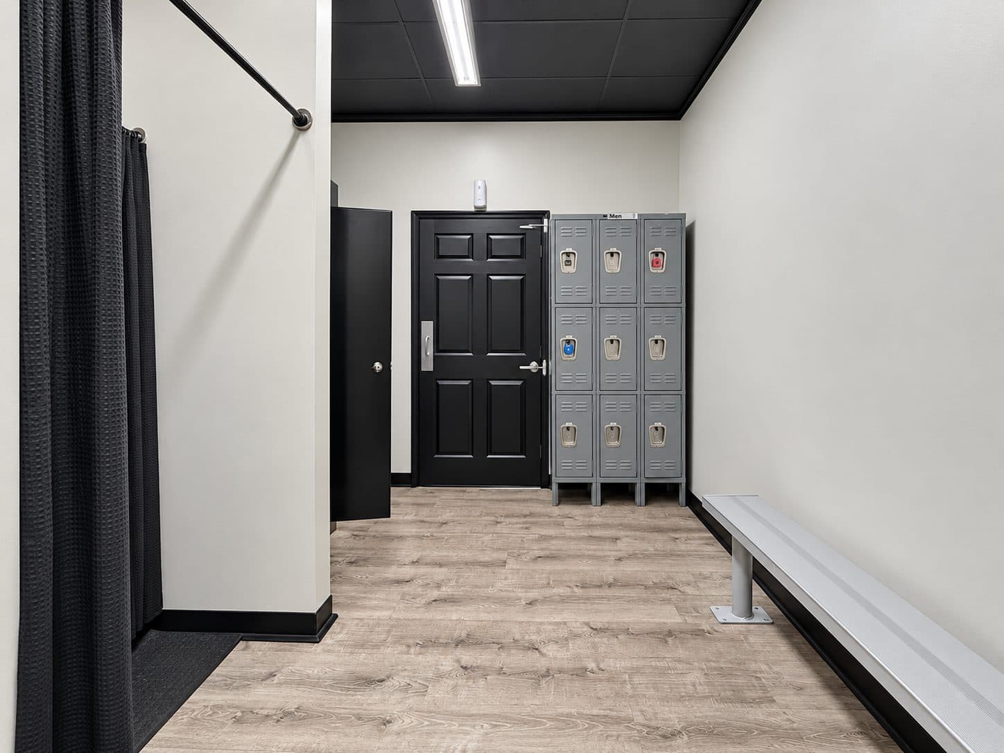 Locker room with bench seating at TNU Fitness