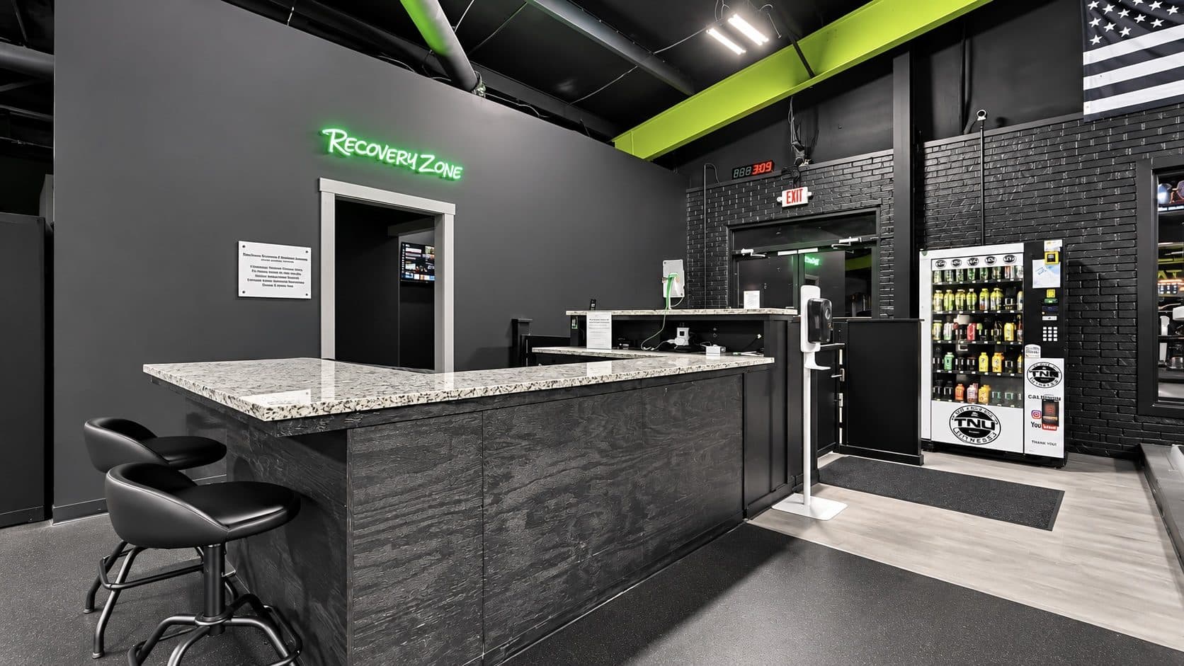 Reception desk and front entrance at TNU Fitness in Calhoun, GA