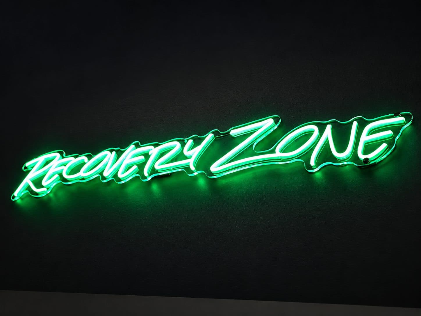 Recovery Zone neon sign at TNU Fitness